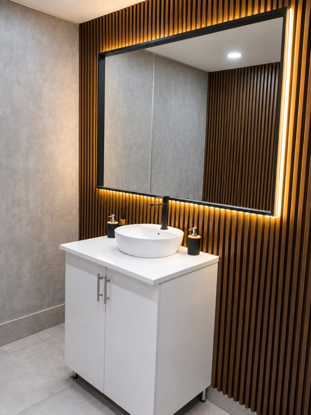 Floating bathroom vanity with backlit mirror